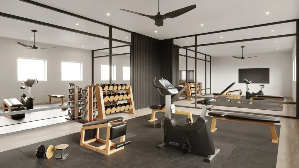 Home gym with a rubber floor, black steel-framed glass partitions and a dumbbell rack