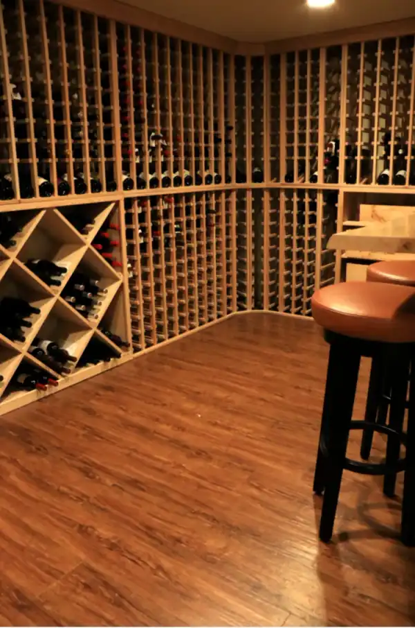 Wine cellar with diamond-bin wood racking and a curved tasting counter